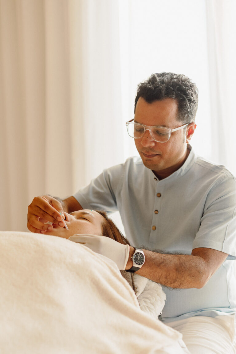 Dr Sohal Shah performing acupuncture needling