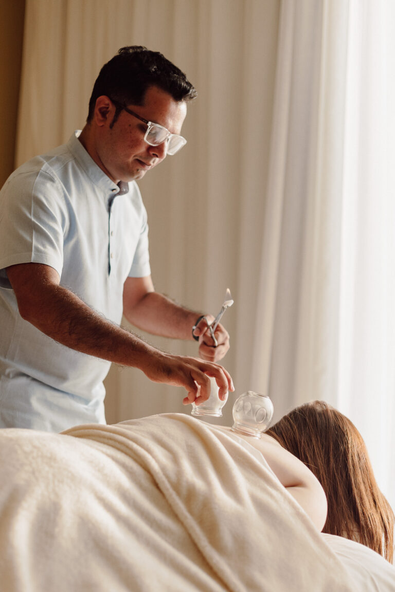 Dr Sohal Shah performing cupping therapy